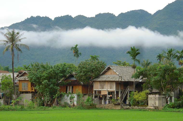 Mai Chau balmboo house under the mist