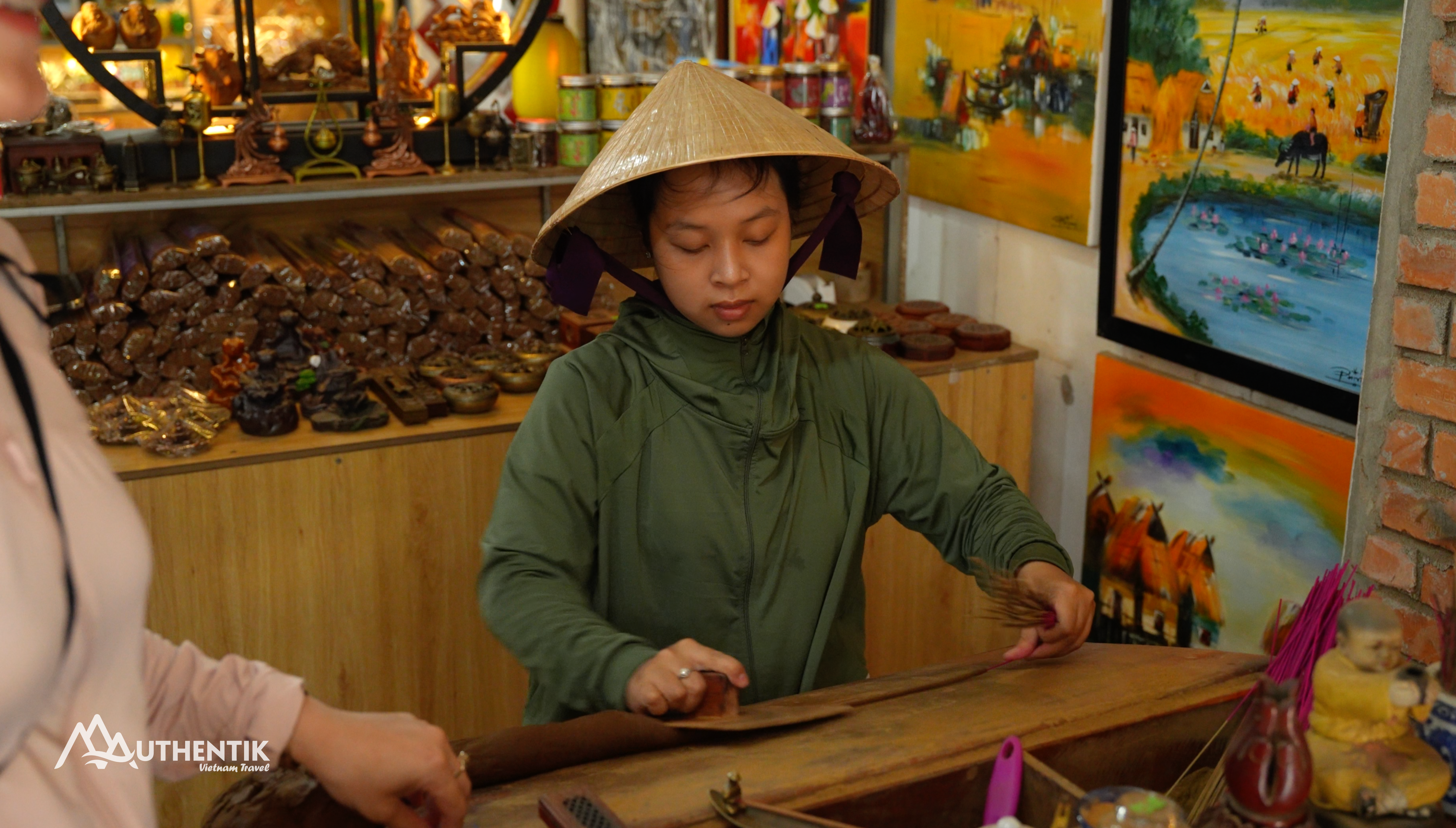 Local artisan making incense by hand in Thuy Xuan incense village in Hue