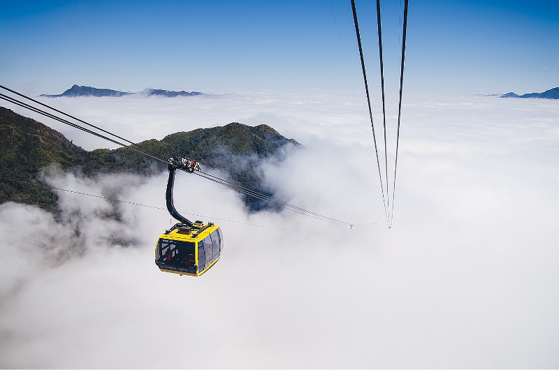 Visitors can conquer the Fansipan by trekking, or with cable car