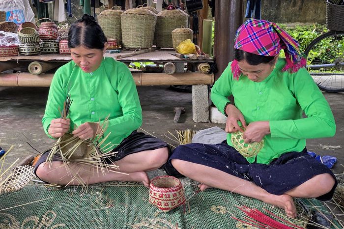 Tay artisan demonstrating traditional bamboo weaving techniques