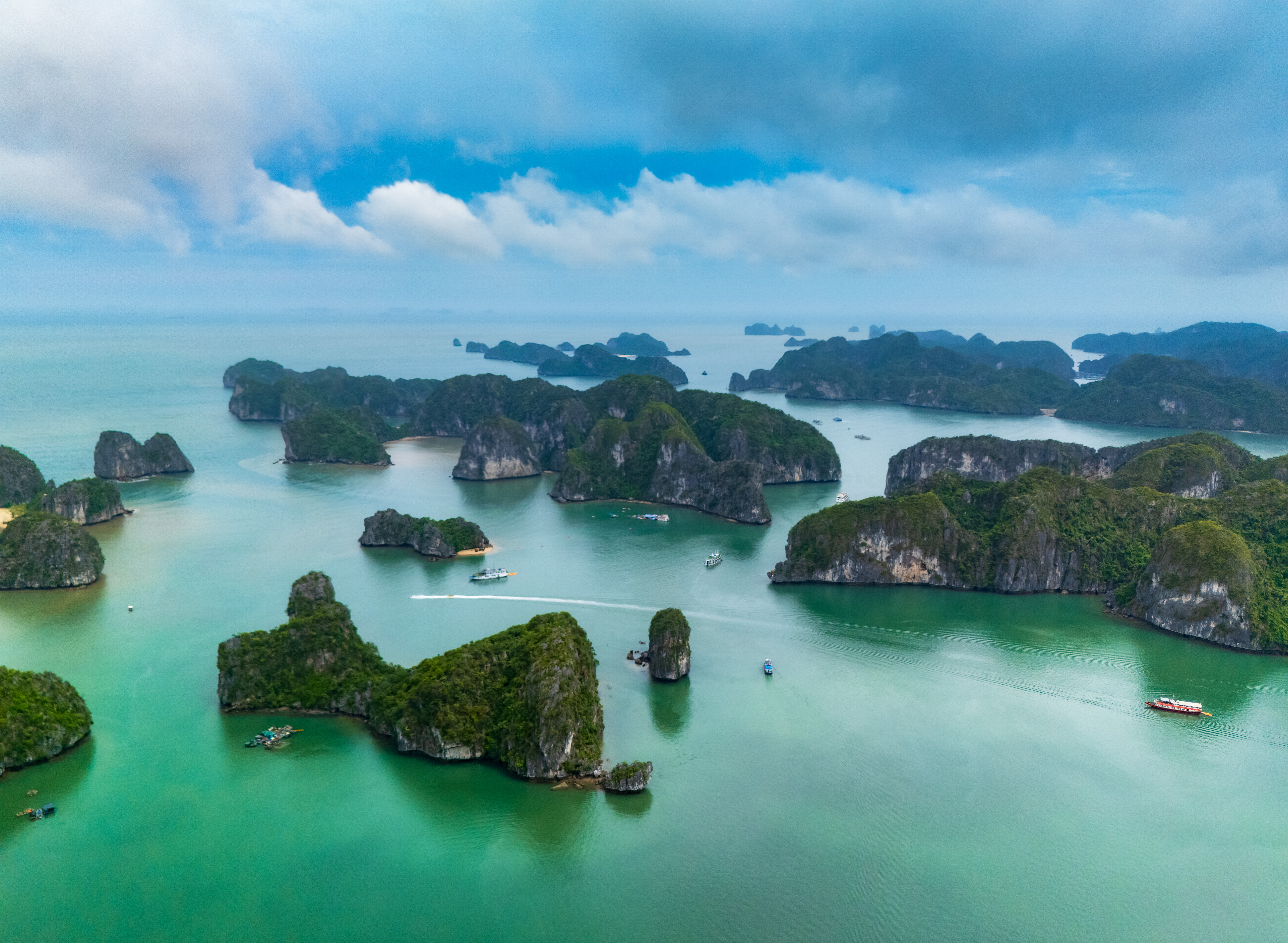 Scenic view of Lan Ha Bay with limestone islands and calm emerald water