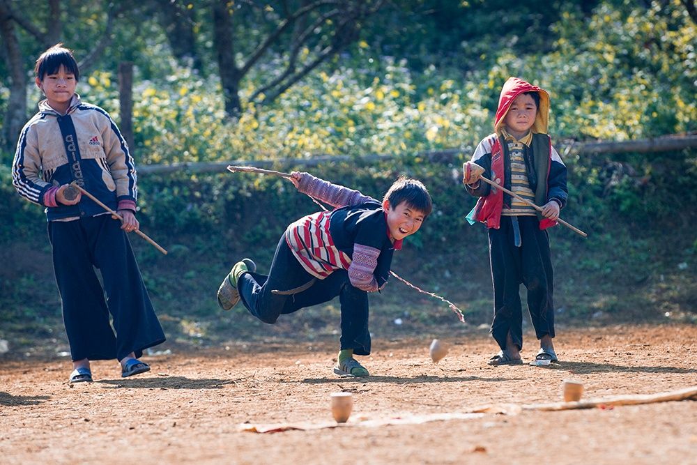 Spinning tops is one of the traditional folk games that boys really enjoy