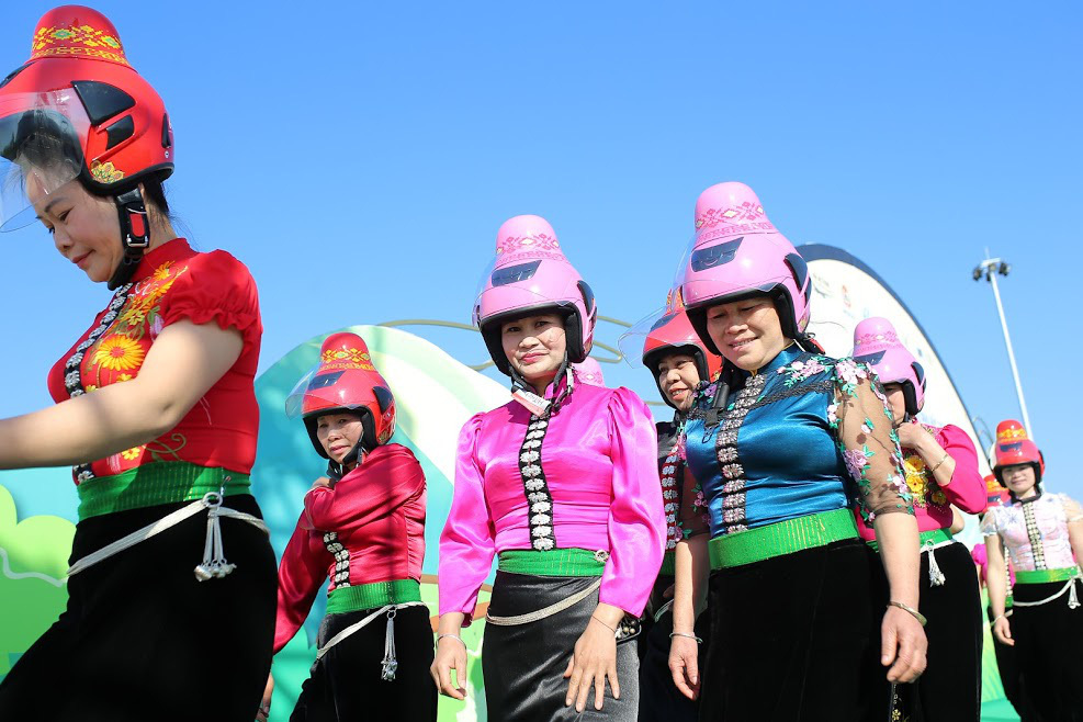 Black Thai women and special helmets designed for their hair