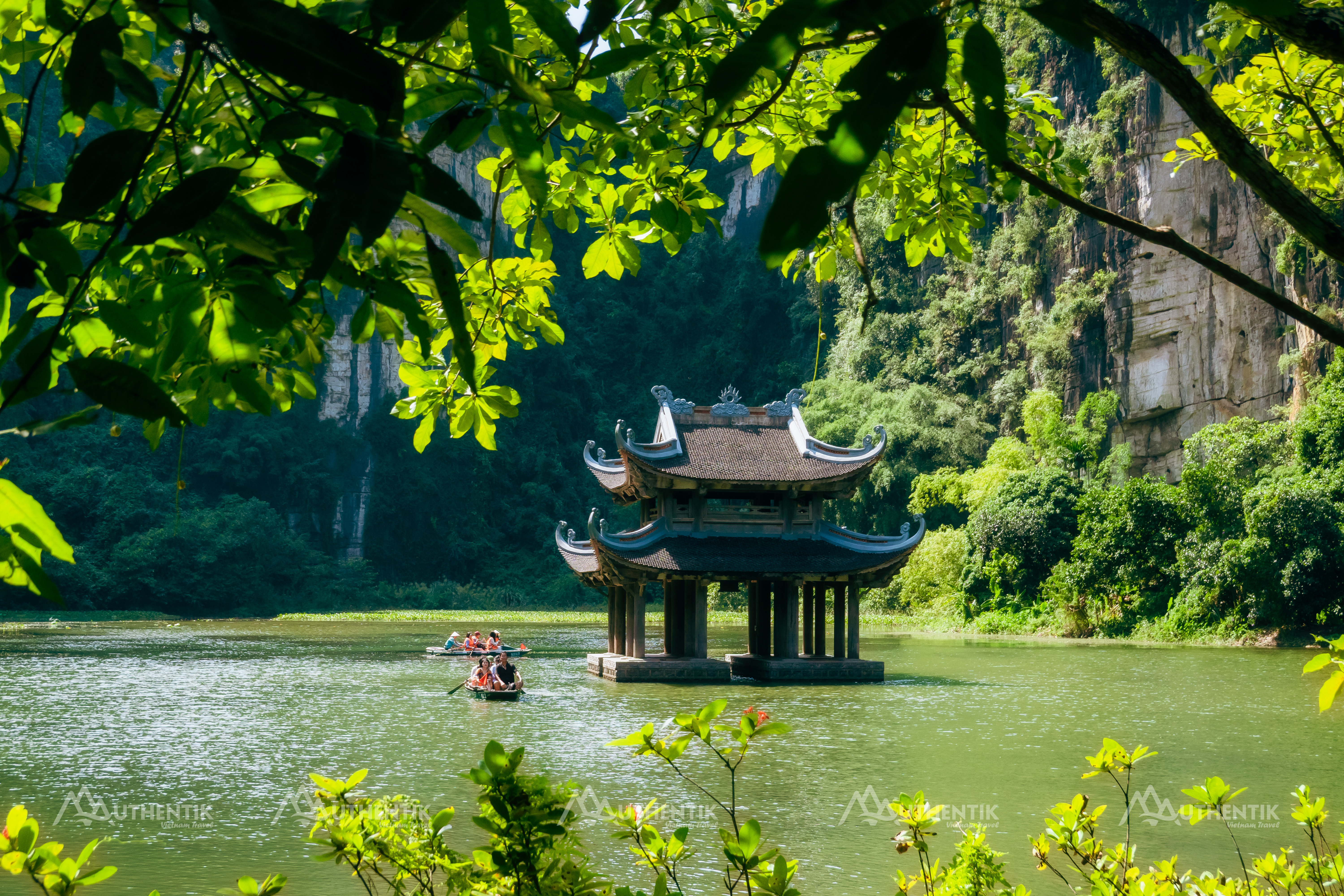 Traditional boat tour through the waterways of Trang An, Ninh Binh