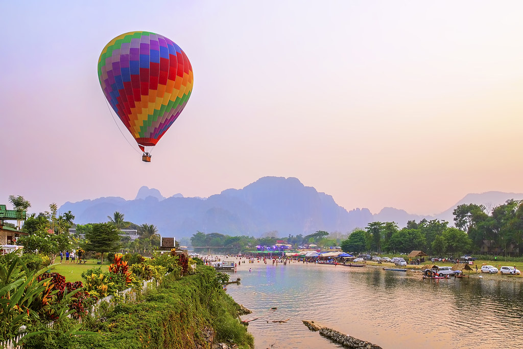 Visitors can experience a hot air balloon ride in Vang Vieng, Laos