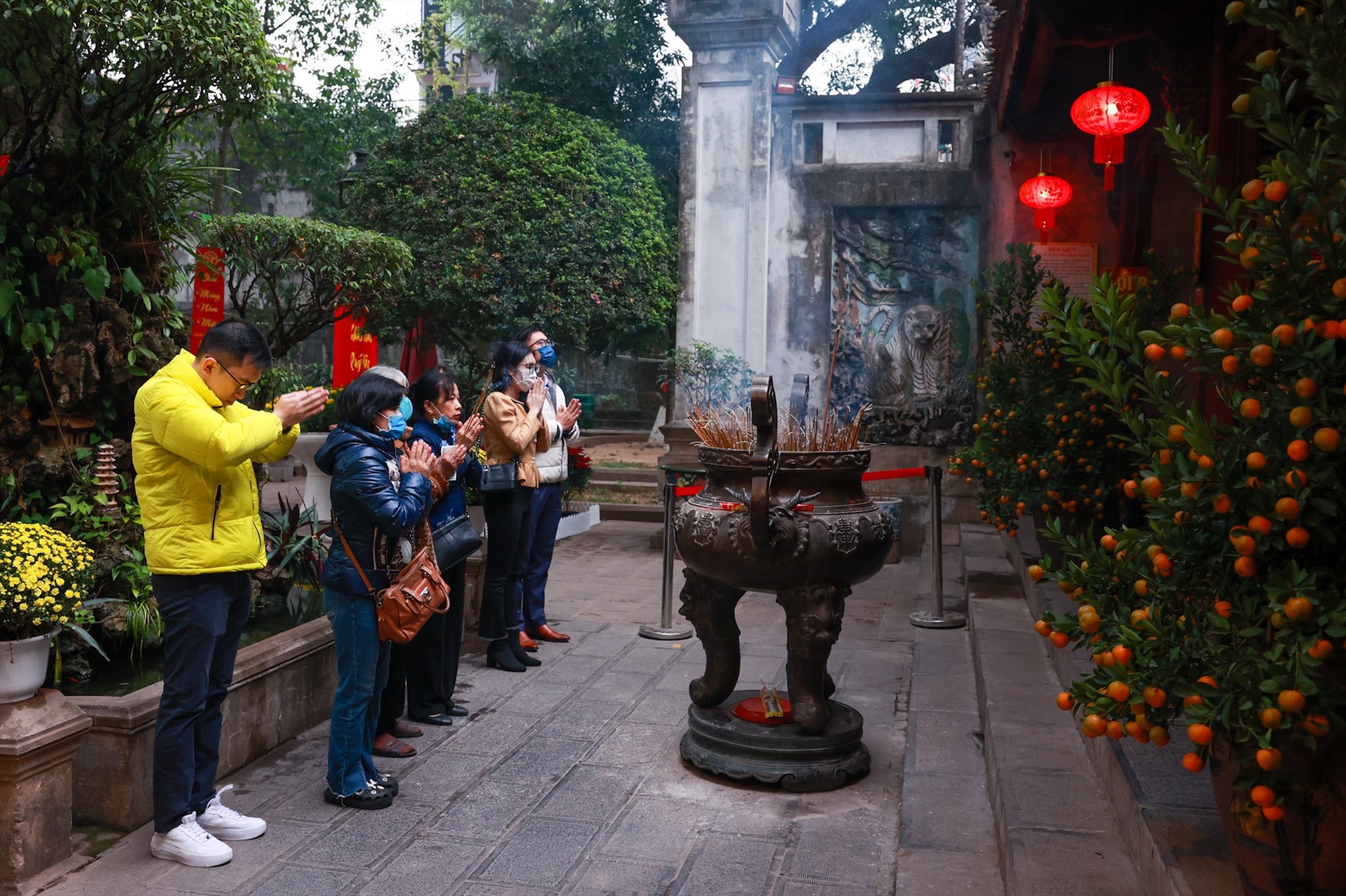 Visitors wearing modest attire at a Vietnamese temple